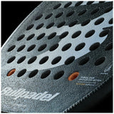 Close-up of a black padel racket with circular holes and glossy finish. The Padel Smash Academy brand is visible, highlighting its VERTEX 04 2025 JUAN TELLO model from the Proline Collection, offering total control with a textured dotted pattern for enhanced play.