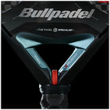 Close-up of a BULLPADEL RACKET XPLO 2025 MARTÍN DI NENNO, showcasing Padel Smash Academy. The handle features red and black accents with X-PLORER and XPLO, along with the text THE PADEL SPECIALIST on this sleek design.