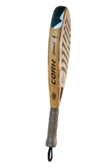 The Cork Padel Premium Control II, designed with a curved shape, perforated design, and brown handle labeled CORK, embodies traditional jai alai elegance. Perfect for advanced players seeking precision, it sets the standard as a premium control racket.