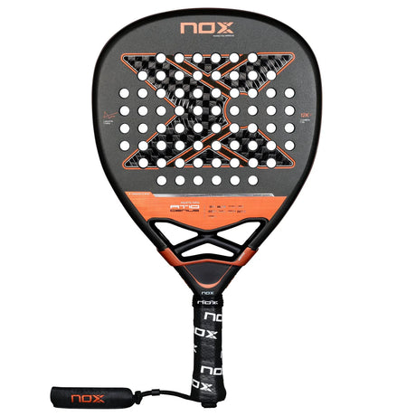 The NOX Agustín Tapia 2025 Racket features a circular head with hole patterns, Exclusive Spin Technology, and an X center. It has a black grip and wrist strap, crafted from 12K Carbon in black and orange.