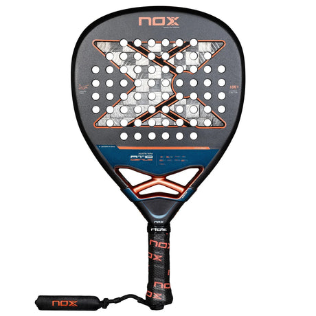 The Nox Padel Racket AT10 Genius Attack 18K Alum 2025 by Agustin Tapia features a black and orange design, crafted with 18K carbon. It has circular holes, an X design on the face, the brand NOX displayed at the top and handle, a black grip, and a wrist strap for optimal performance.