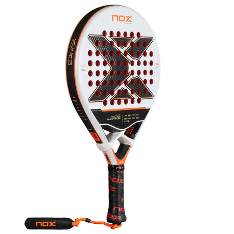 The NOX ML10 Quantum 3K 25 padel racket by Miguel Lamperti features a unique X-shaped face with hexagonal holes, a white and orange color scheme, and a black handle with an orange strap. It incorporates hybrid technology and uses photochromic paint for an innovative touch.