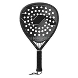 The VARLION BOURNE SUMMUM CARBON BLACK is a black padel racket with Aerodynamic Drilling technology for improved control. It features a geometric design, perforated surface, and a bidirectional carbon tubular frame. The grip has black tape and includes a wrist strap on the handle.