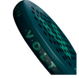 The image showcases a dark blue Volt VOLT 900 v4 padel racket with teal accents, featuring a 3K Carbon Structure with honeycomb patterns and circular holes. The background is white.