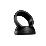 The sleek VOLT BOOSTER by Volt is a black ring with BOOSTER embossed, angled on a matching base against a dark backdrop. This padel racket accessory combines modern aesthetics with a power boost for your game.